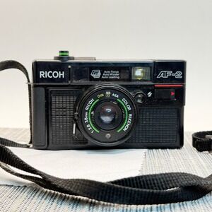 Vtg Ricoh AF-2 35mm Film Camera Color Rikenon 38mm f2.8 Lens Auto Focus Black